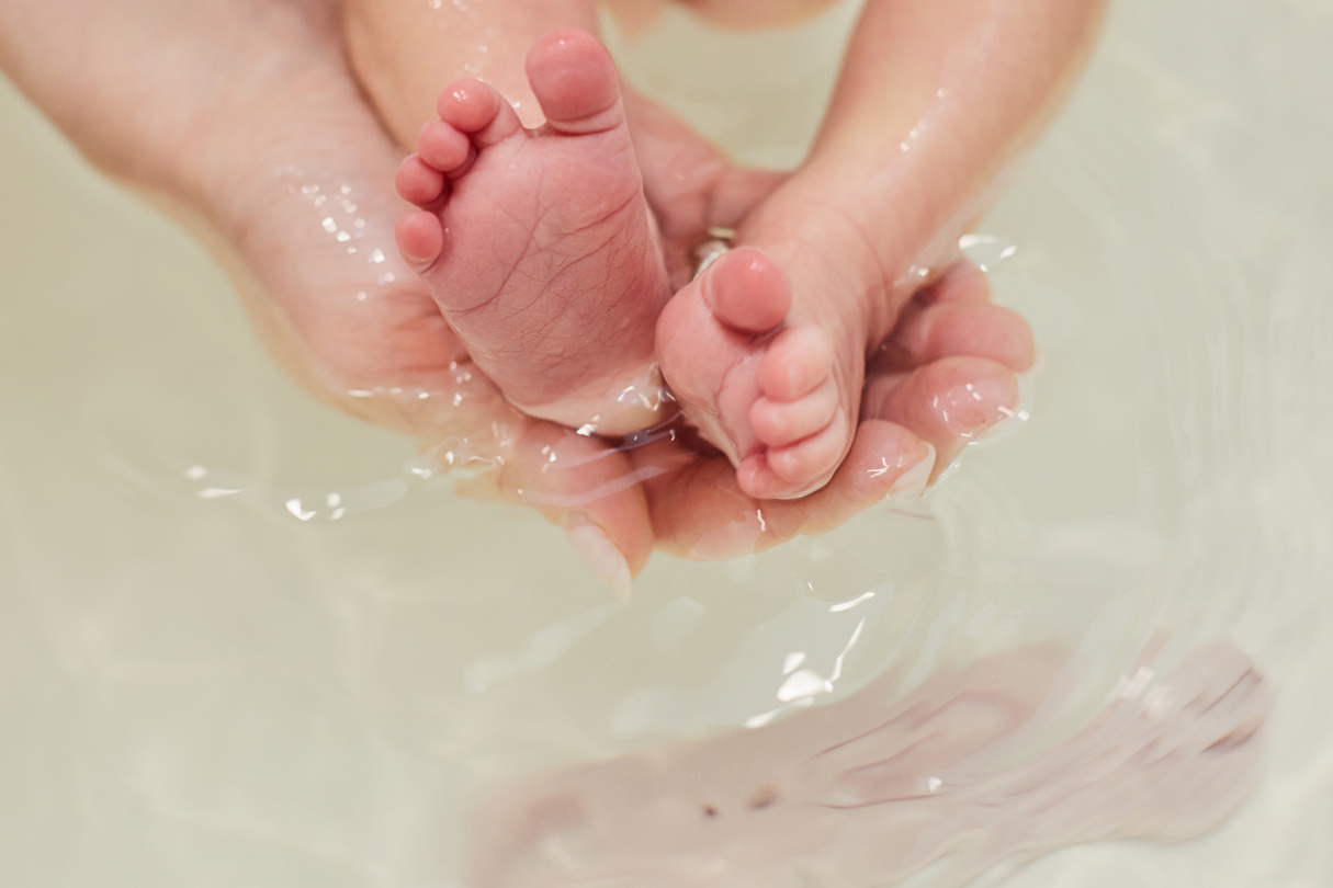 Baby Feet in Bath. Baby Skin Care.